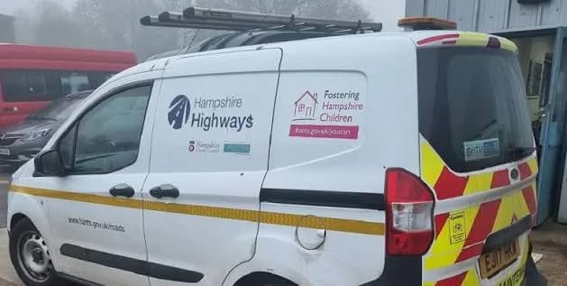 White Hampshire Highways van in red and yellow rear markings, with Fostering Hampshire Children on the side