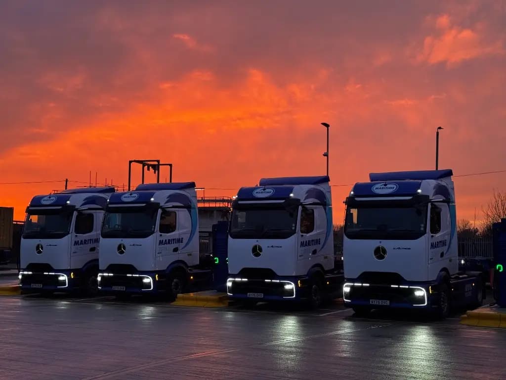 Maritime Transport Mercedes-Benz eActros electric HGVs at a charging depot at dusk from Dynamon ZERO and RouteZERO case study