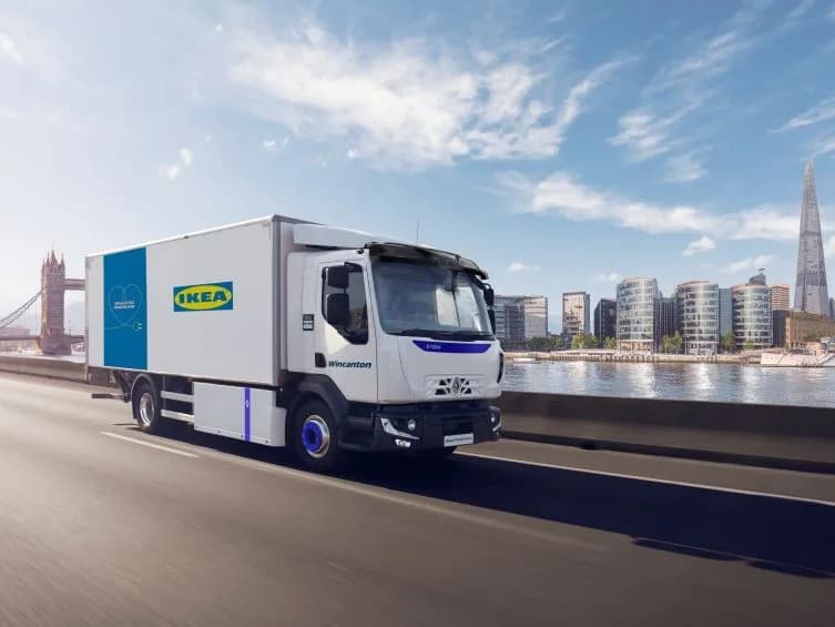 IKEA-branded Wincanton electric home delivery truck operating in London with Tower Bridge visible