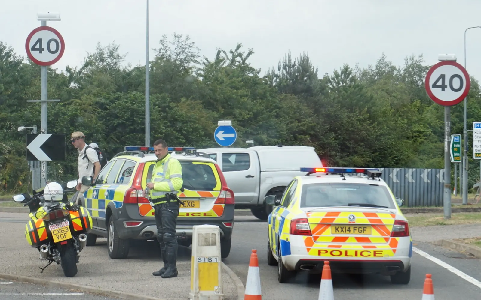 Marked Northamptonshire Police car and motorcycle in battenburg markings near Silverstone — photo by Ian S, CC BY-SA 2.0
